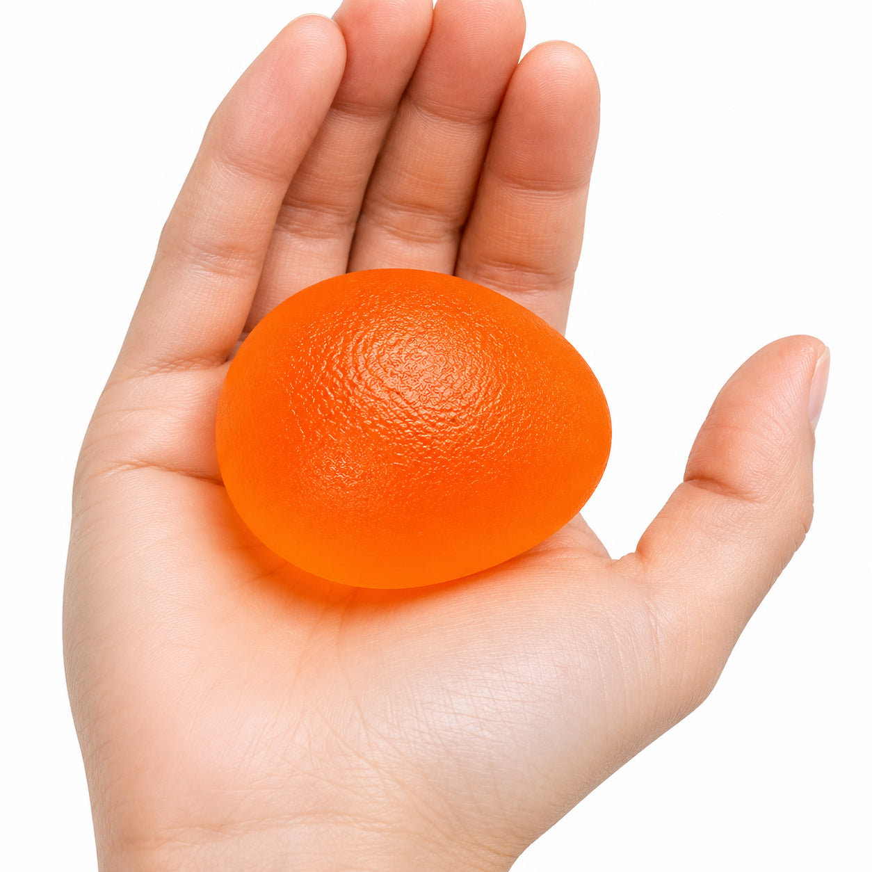 Handträningsboll i orange för daglig handträning och fingerstyrka.